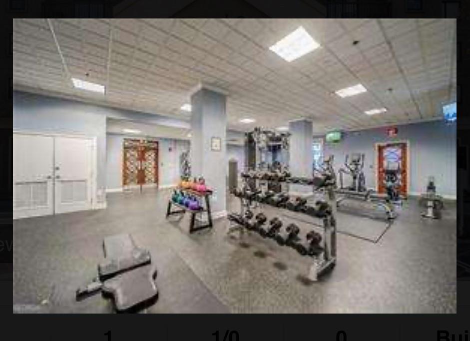 795 Hammond Drive, Unit 210 Atlanta, GA 30328 - Photo 4 of 18 a living room with furniture and a potted plant