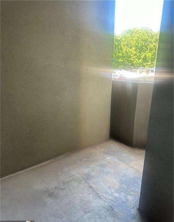 795 Hammond Drive, Unit 210 Atlanta, GA 30328 - Photo 5 of 18 an empty room with windows