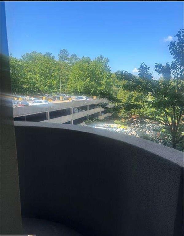 795 Hammond Drive, Unit 210 Atlanta, GA 30328 - Photo 6 of 18 a view of a yard from a balcony
