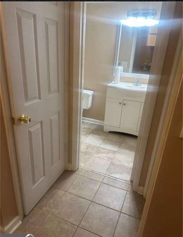 795 Hammond Drive, Unit 210 Atlanta, GA 30328 - Photo 10 of 18 a bathroom with a sink and a mirror