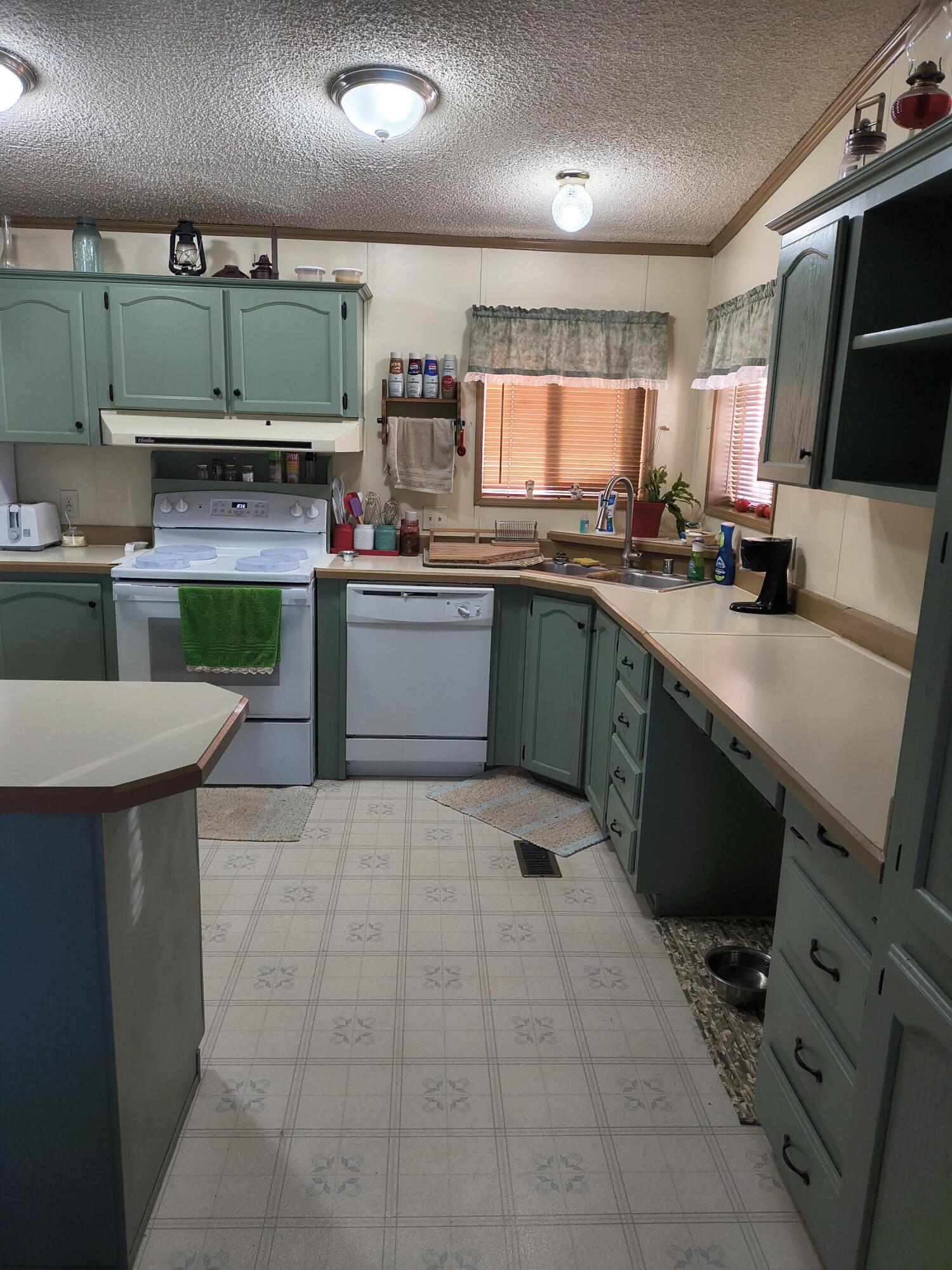 235 North Roosevelt Street Merrill, OR 97633 - Photo 11 of 27 a kitchen with a sink cabinets and window