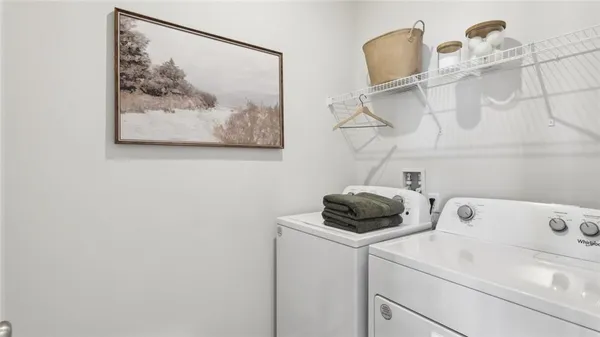 a view of a utility room with racks on the wall