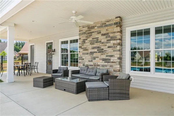 a living room with furniture and windows