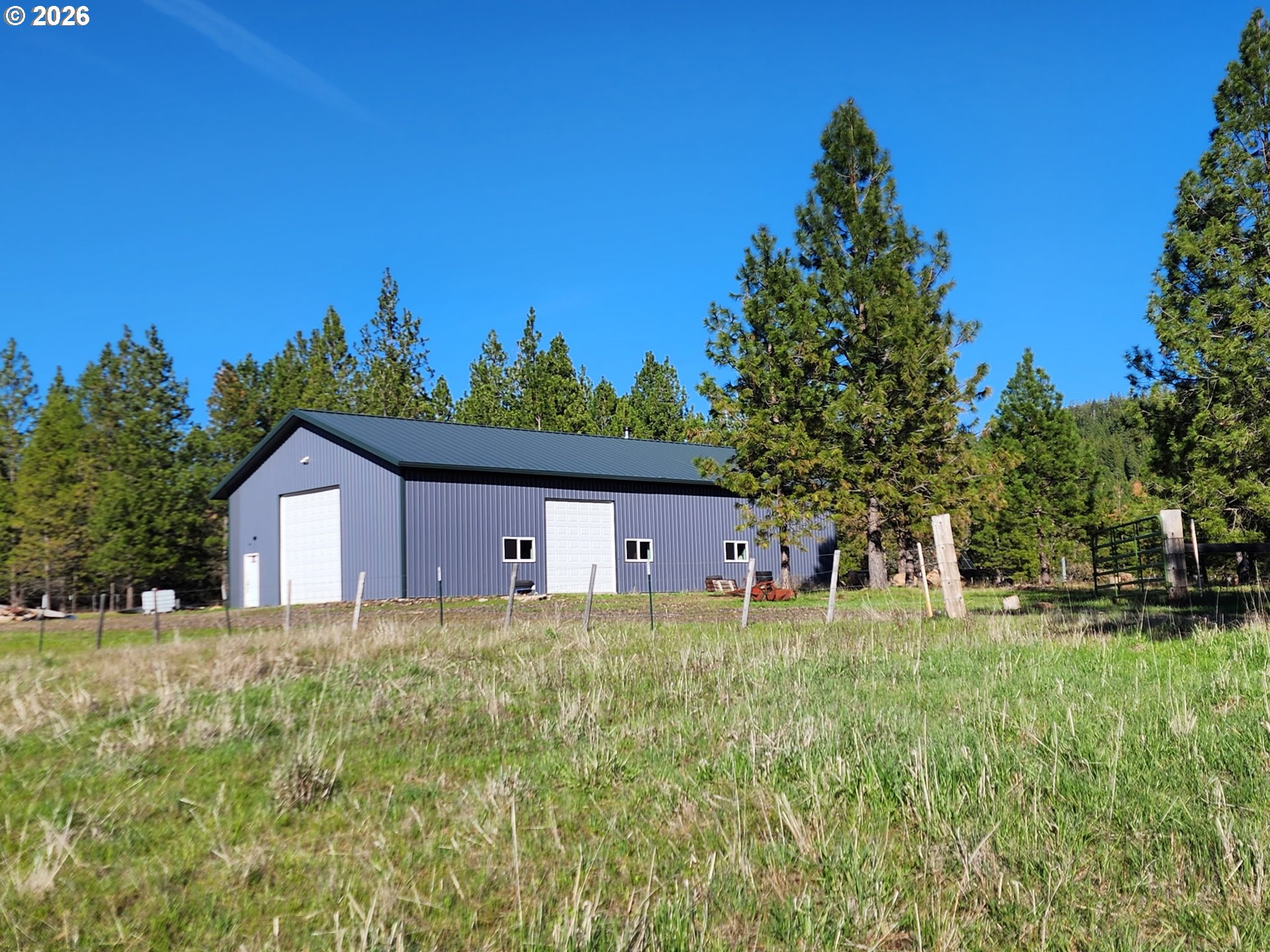 73210 Kingsbury Lane Elgin, OR 97827 - Photo 29 of 37 a front view of a house with a yard