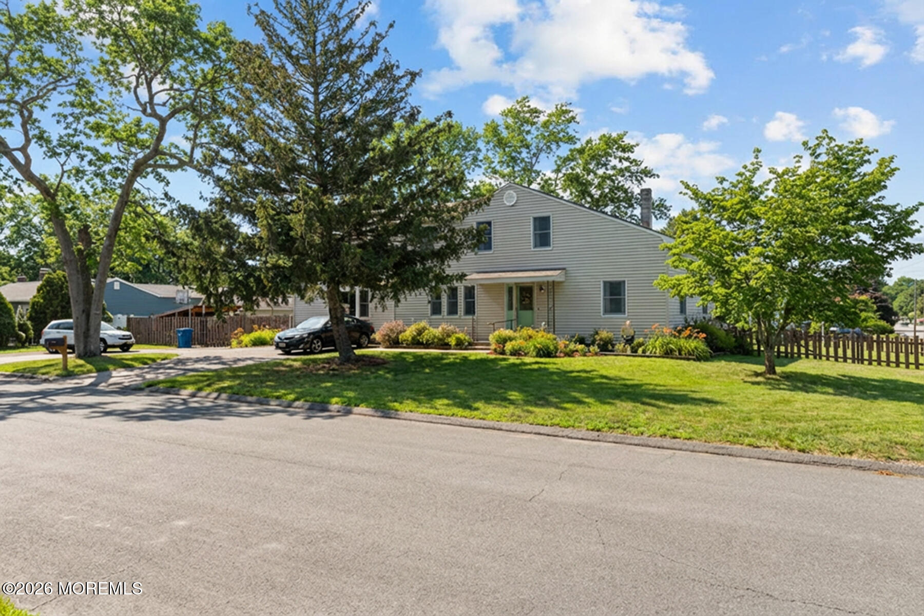 60 Sunset Drive Howell, NJ 07731 - Photo 12 of 56 a front view of a house with a yard and a garden