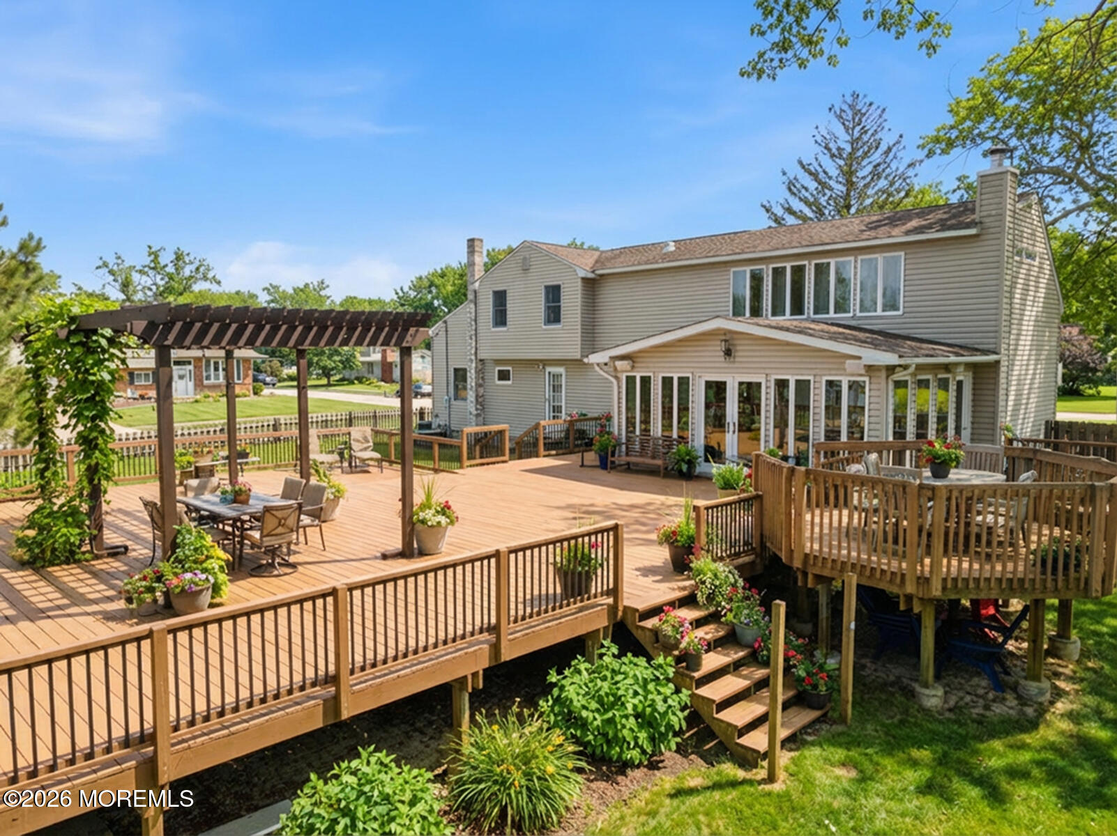 60 Sunset Drive Howell, NJ 07731 - Photo 15 of 56 a view of a house with wooden deck and furniture
