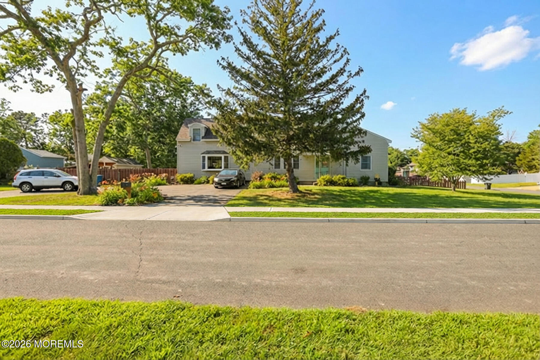 60 Sunset Drive Howell, NJ 07731 - Photo 16 of 56 a front view of a house with a big yard and potted plants