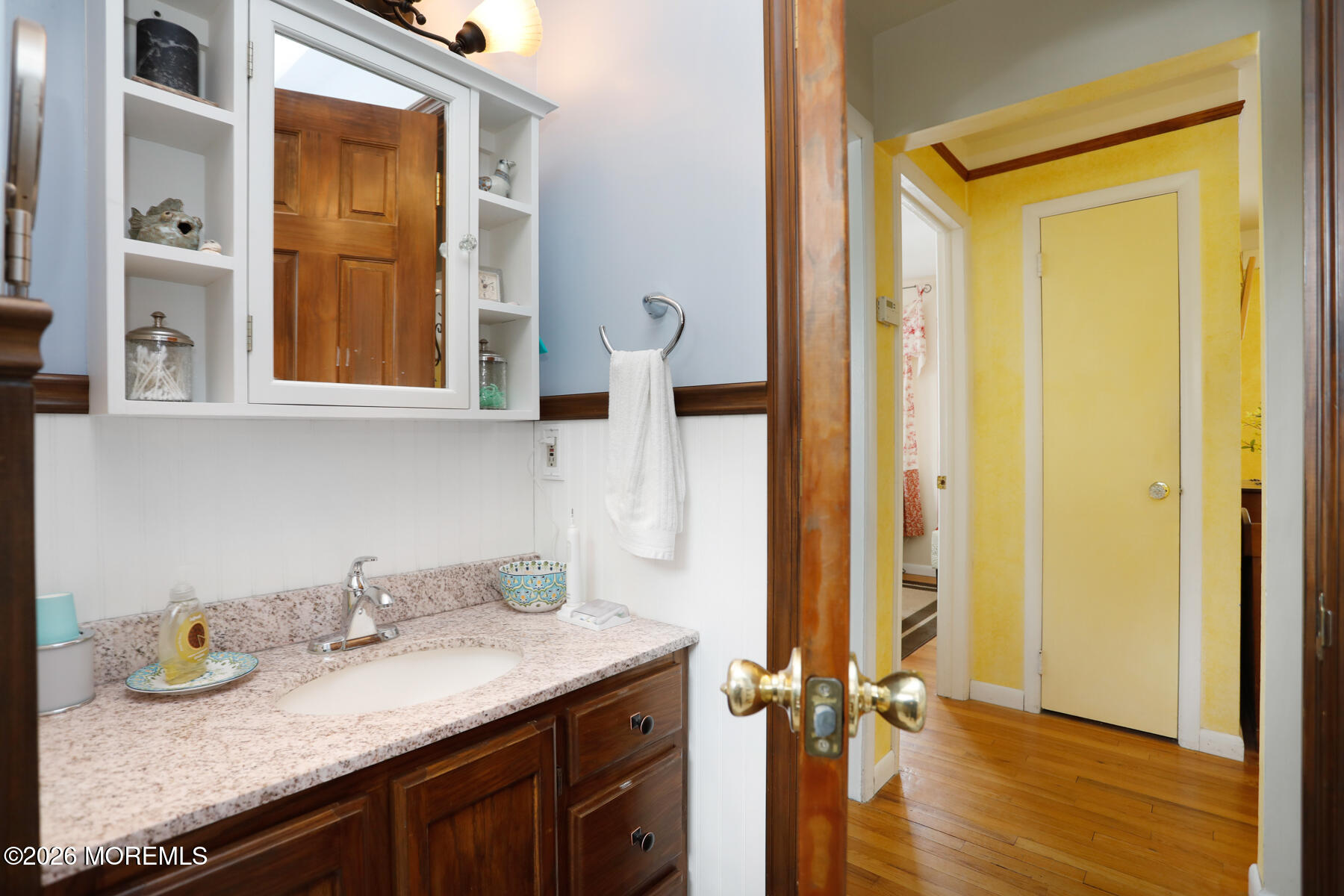 60 Sunset Drive Howell, NJ 07731 - Photo 22 of 56 a bathroom with a granite countertop sink and a mirror