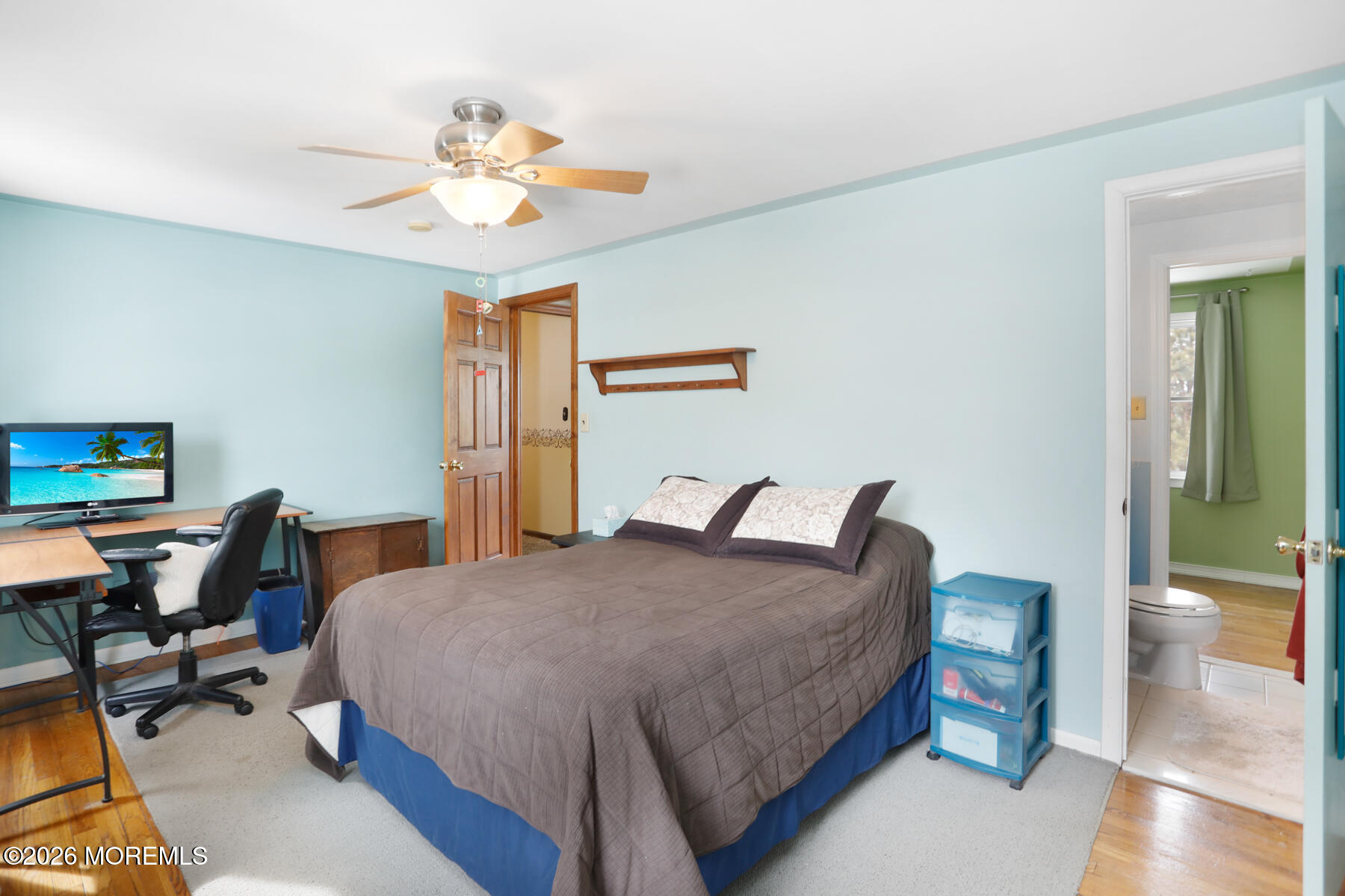 60 Sunset Drive Howell, NJ 07731 - Photo 26 of 56 a bedroom with a bed and a chandelier