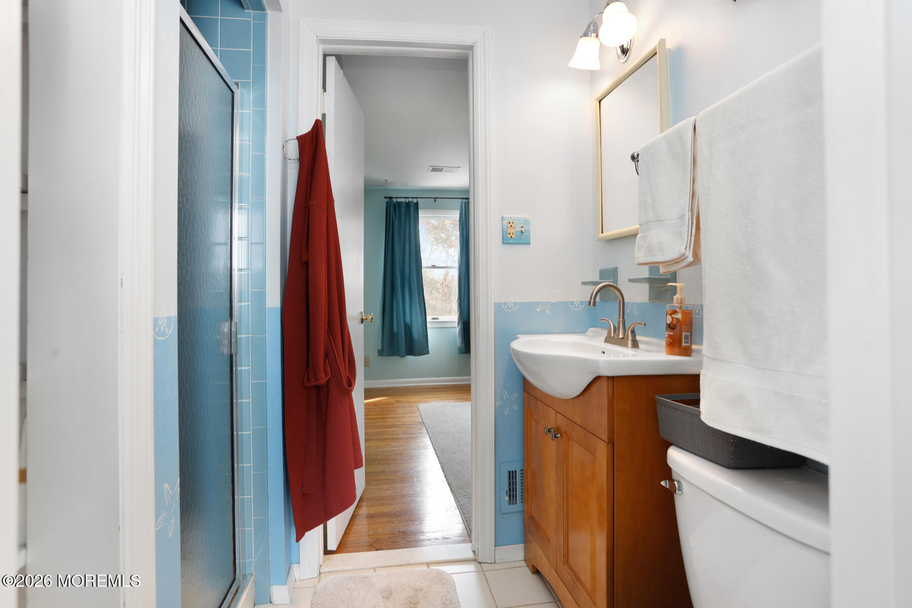 60 Sunset Drive Howell, NJ 07731 - Photo 28 of 56 a bathroom with a sink and a mirror