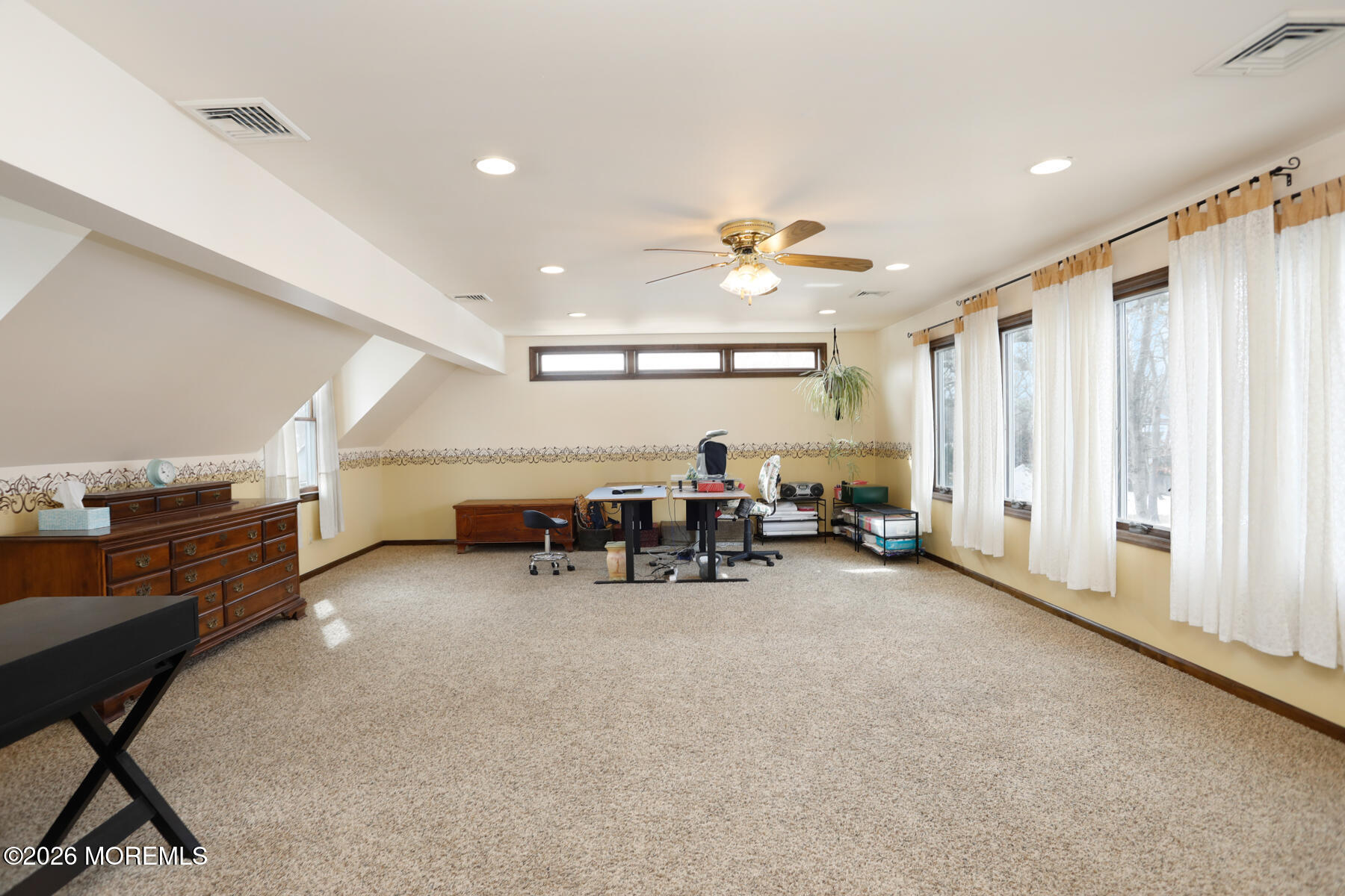 60 Sunset Drive Howell, NJ 07731 - Photo 29 of 56 a view of a livingroom with furniture and a ceiling fan