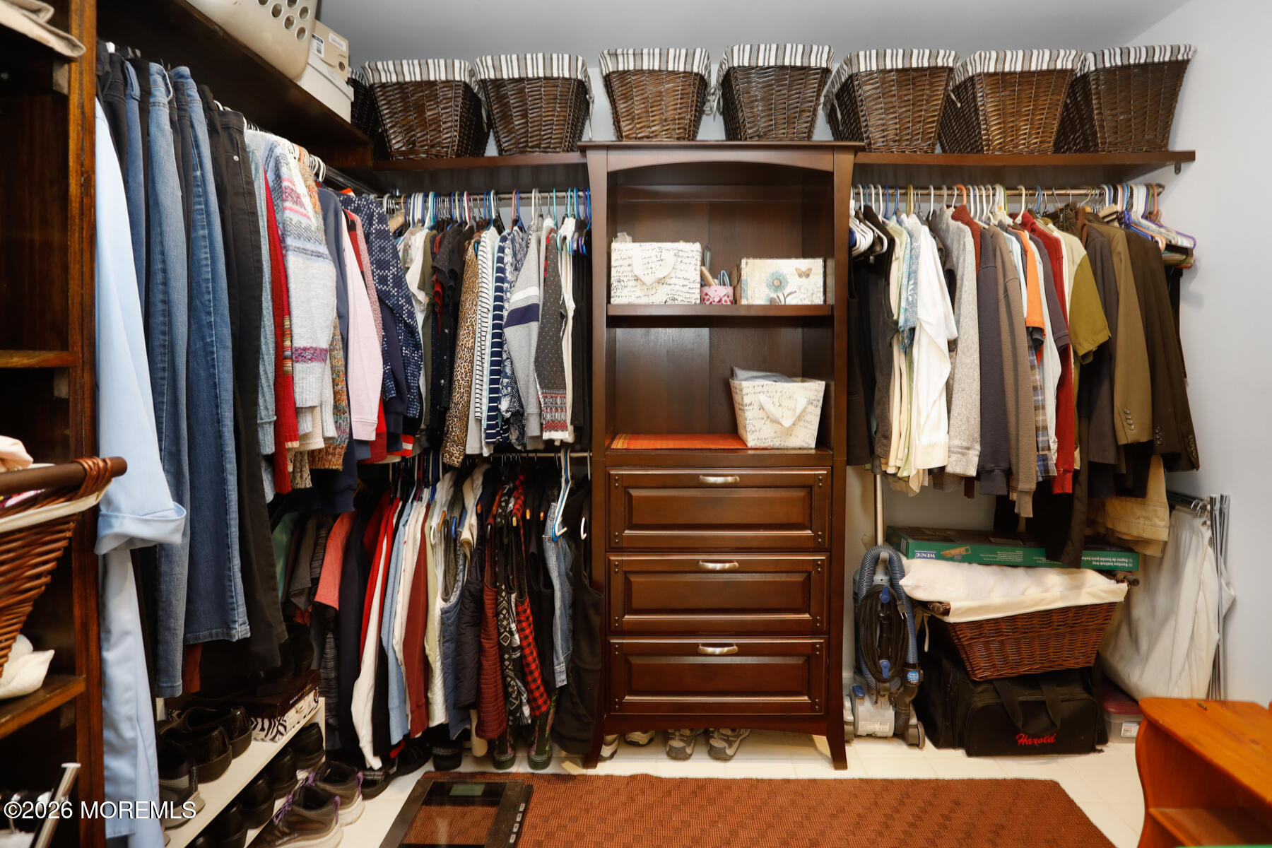 60 Sunset Drive Howell, NJ 07731 - Photo 32 of 56 a view of walk in closet with clothes and shoes