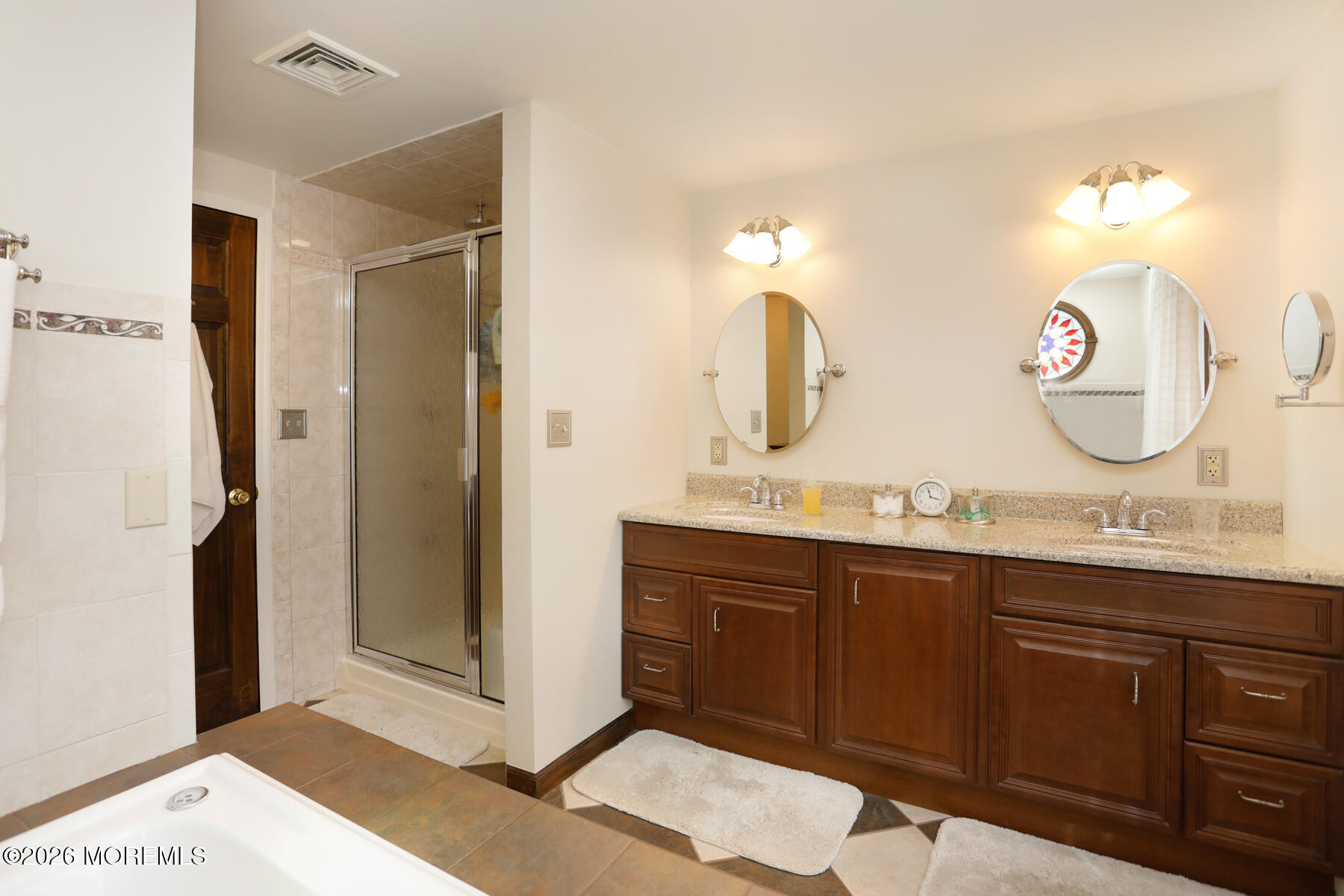 60 Sunset Drive Howell, NJ 07731 - Photo 33 of 56 a spacious bathroom with a double vanity sink and a mirror