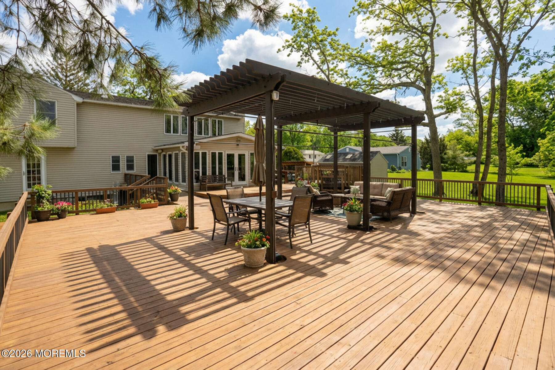 60 Sunset Drive Howell, NJ 07731 - Photo 37 of 56 a view of pool with lawn chairs under an umbrella