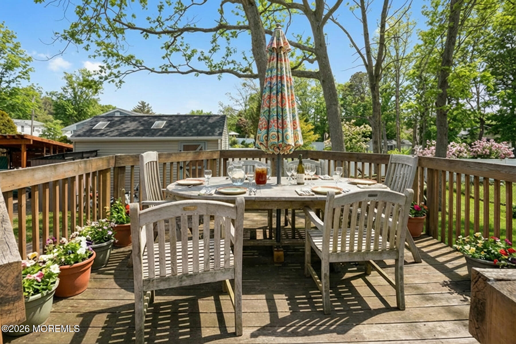 60 Sunset Drive Howell, NJ 07731 - Photo 39 of 56 a view of a chairs and table on the deck