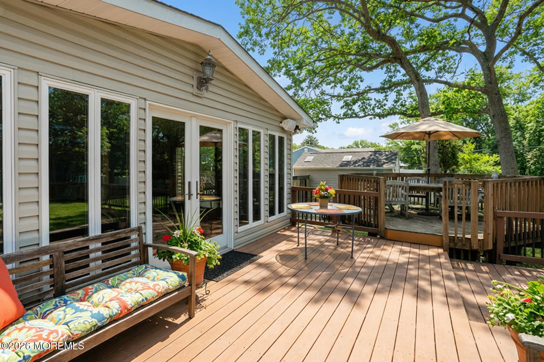 60 Sunset Drive Howell, NJ 07731 - Photo 40 of 56 a view of a patio with table and chairs barbeque potted plants and large tree