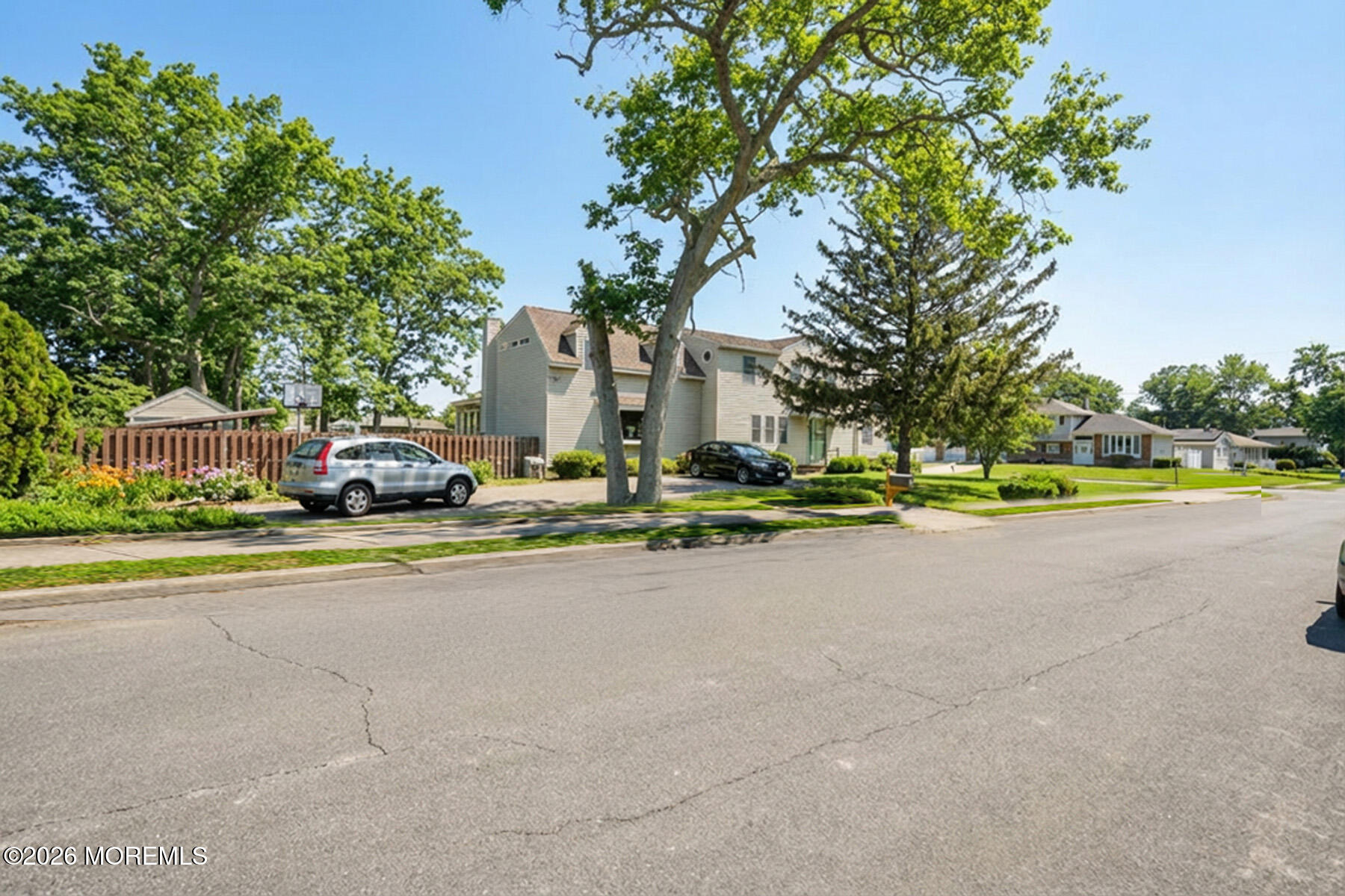60 Sunset Drive Howell, NJ 07731 - Photo 51 of 56 a view of street with houses and trees in the background