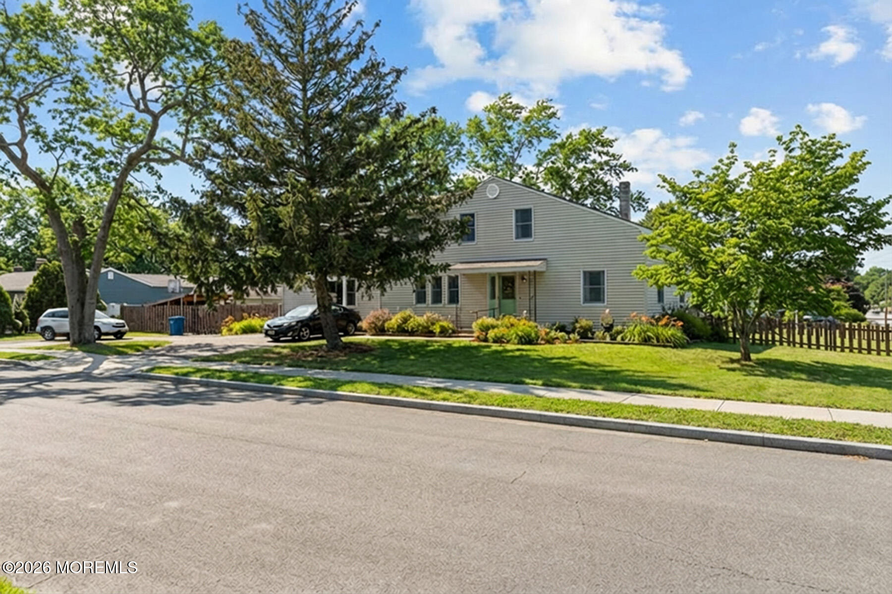 60 Sunset Drive Howell, NJ 07731 - Photo 53 of 56 a front view of a house with a yard and large trees