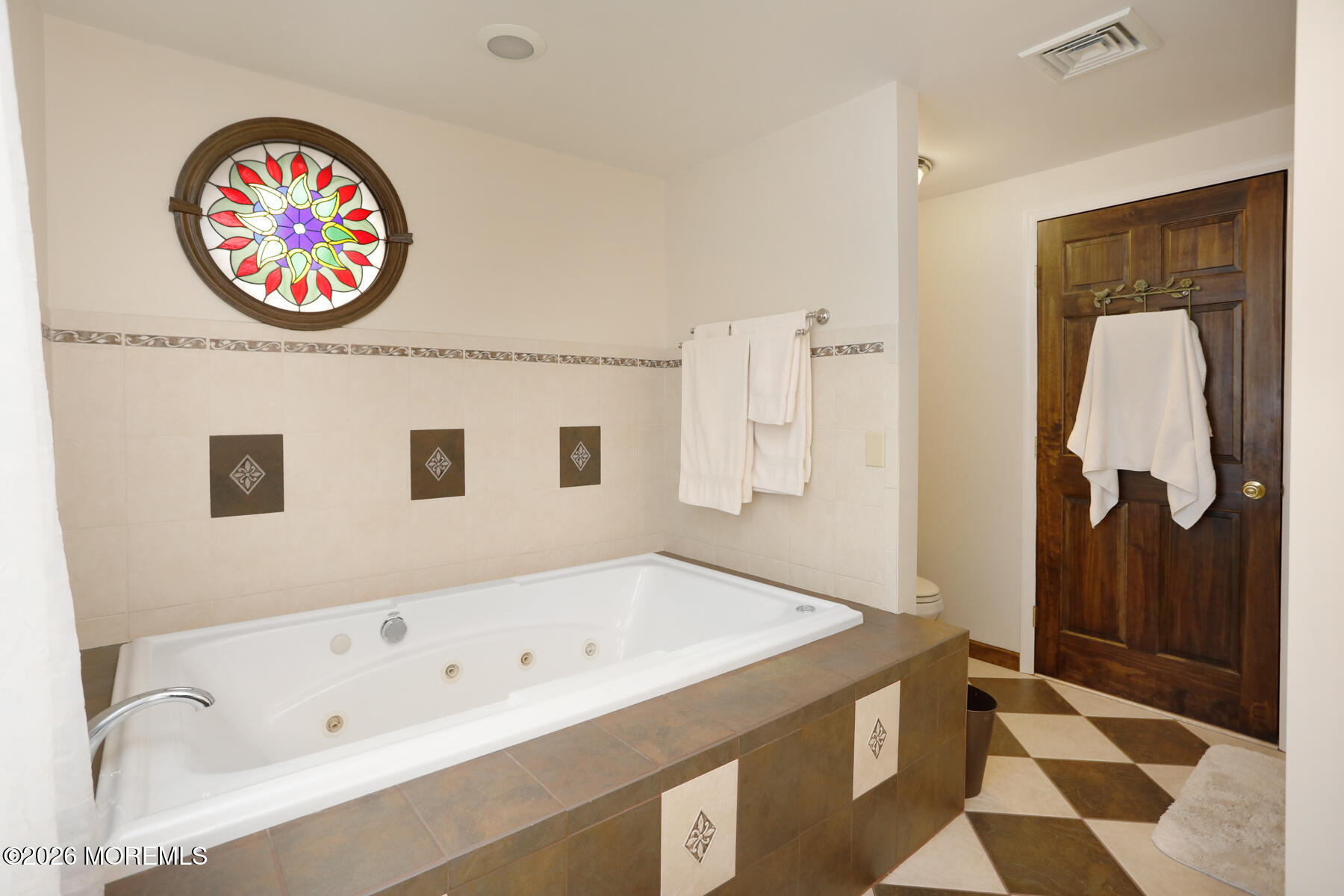 60 Sunset Drive Howell, NJ 07731 - Photo 10 of 56 a bathroom with a bathtub and a shower