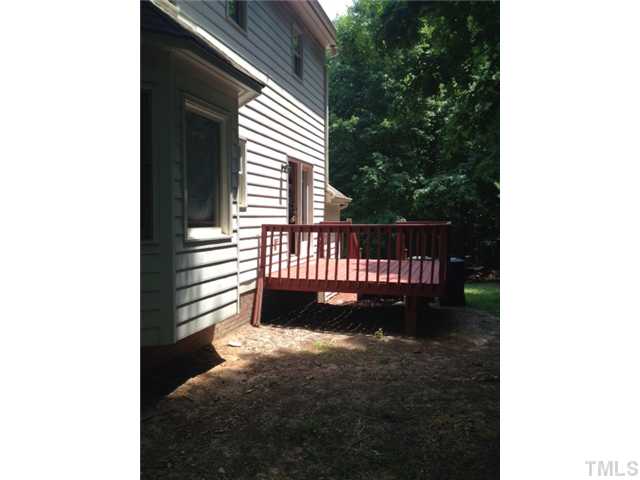 2409 Eleanor Rigby Court Raleigh, NC 27603 - Photo 12 of 14 Back deck with great privacy in wooded back area.