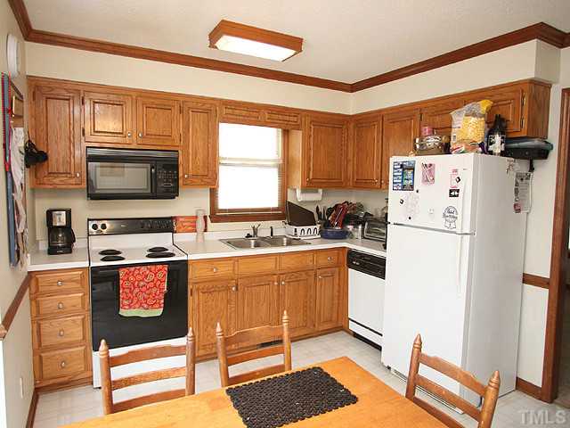 2409 Eleanor Rigby Court Raleigh, NC 27603 - Photo 4 of 14 Good size kitchen includes all appliances.