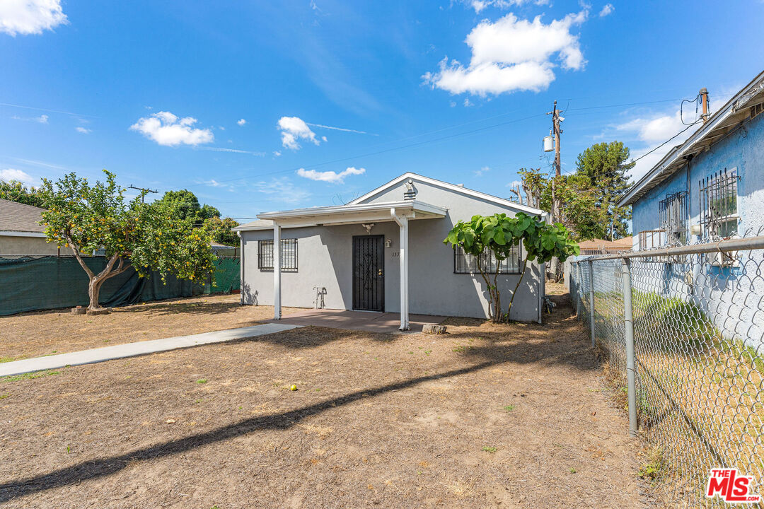 15321 South Frailey Avenue Compton, CA 90221 - Photo 13 of 19 a view of a house with a patio and potted plants