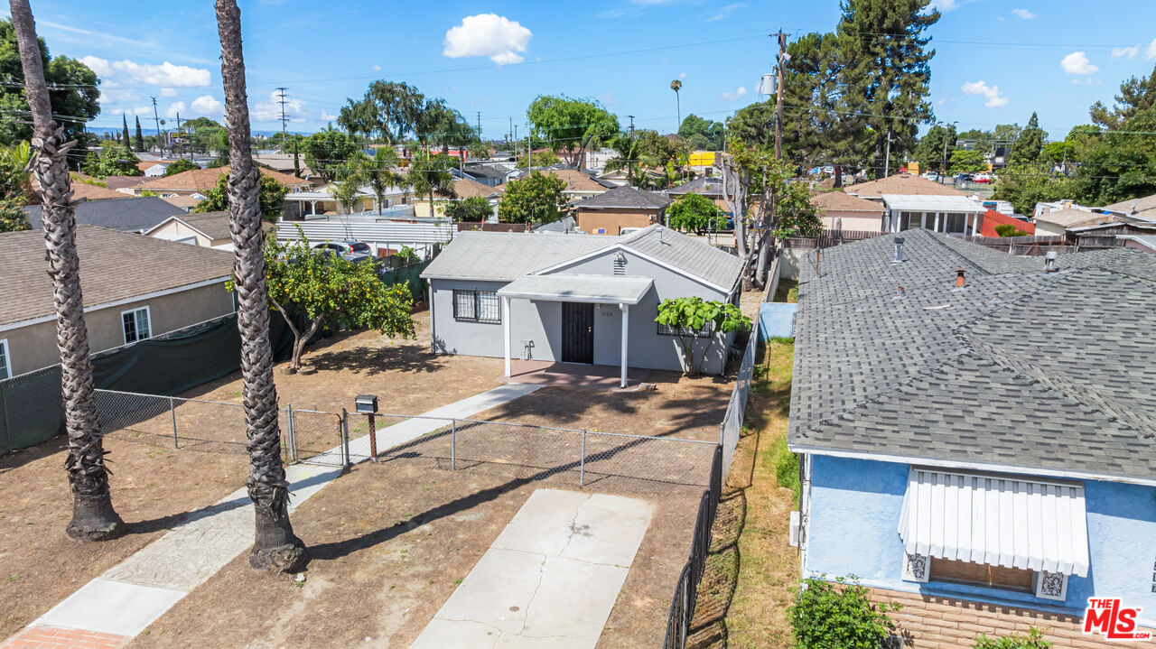 15321 South Frailey Avenue Compton, CA 90221 - Photo 15 of 19 a view of a house with backyard