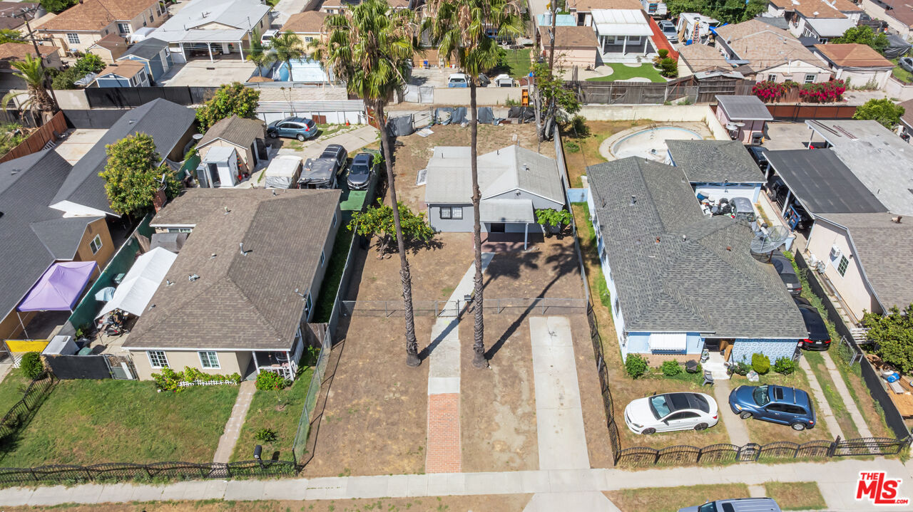 15321 South Frailey Avenue Compton, CA 90221 - Photo 16 of 19 an aerial view of residential houses with outdoor space and street view
