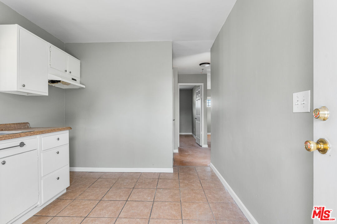 15321 South Frailey Avenue Compton, CA 90221 - Photo 8 of 19 a view of cabinets and utility room with closet