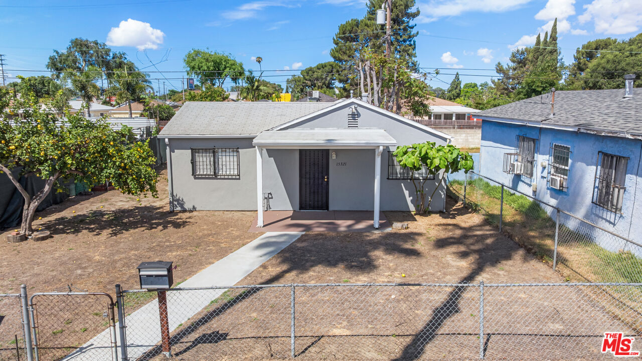 15321 South Frailey Avenue Compton, CA 90221 - Photo 10 of 19 a front view of a house with a porch