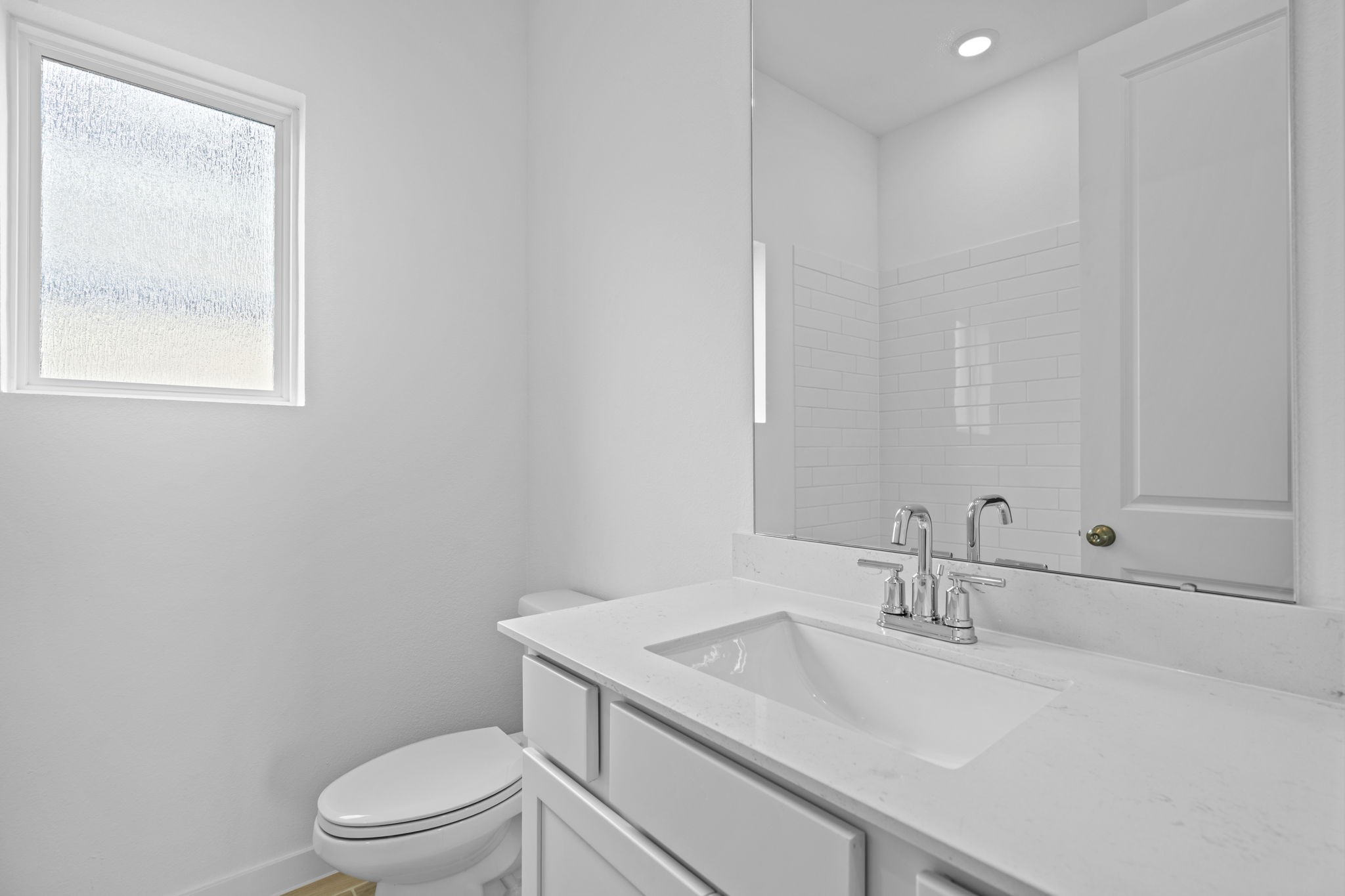 2720 Grove Crest Drive Rosenberg, TX 77469 - Photo 24 of 32 Stylish secondary bathroom featuring a quartz vanity, contemporary fixtures, and a tiled tub/shower combination.