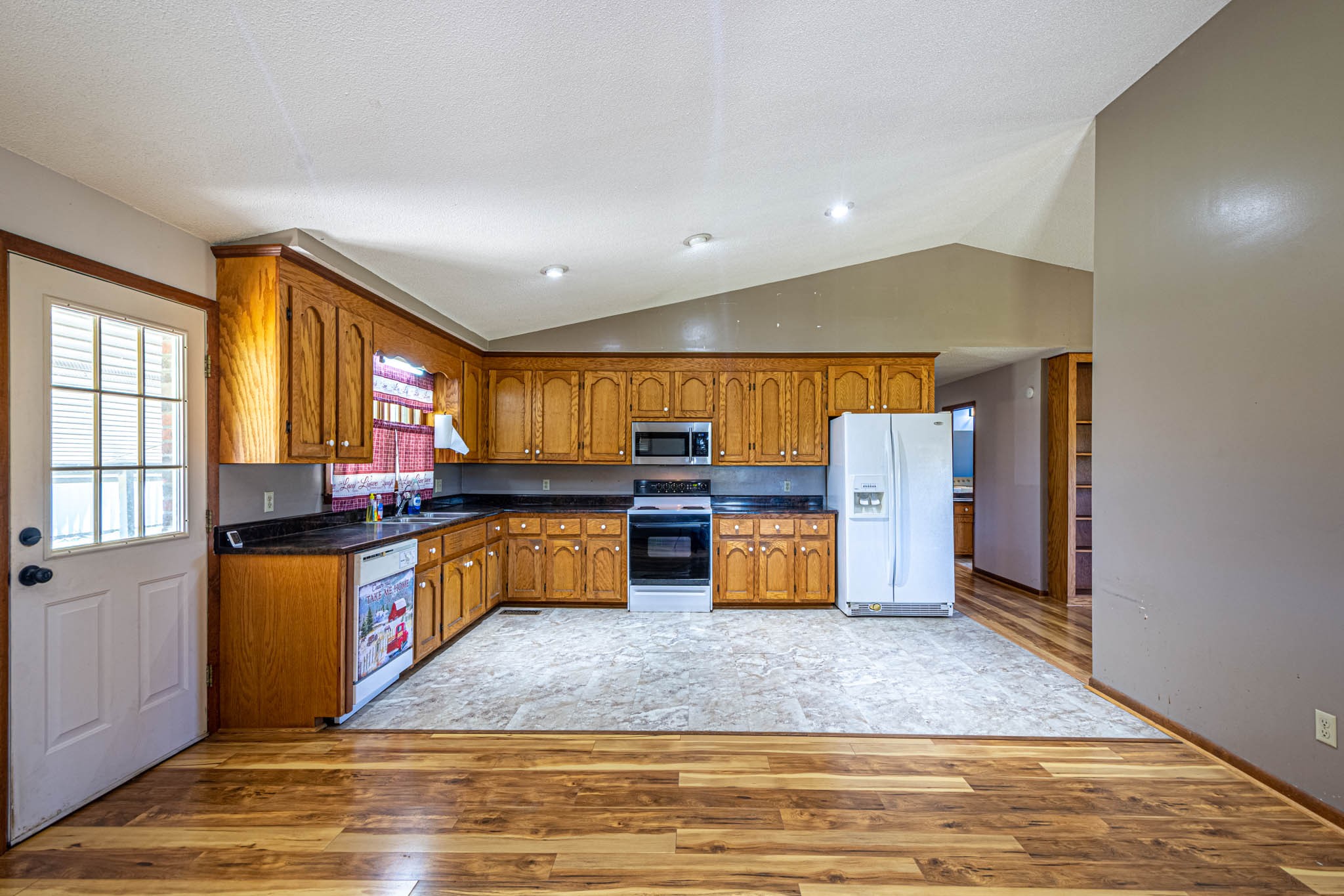 2515 Briar Patch Road Prospect, TN 38477 - Photo 13 of 43 a kitchen with stainless steel appliances kitchen island granite countertop a refrigerator and stove