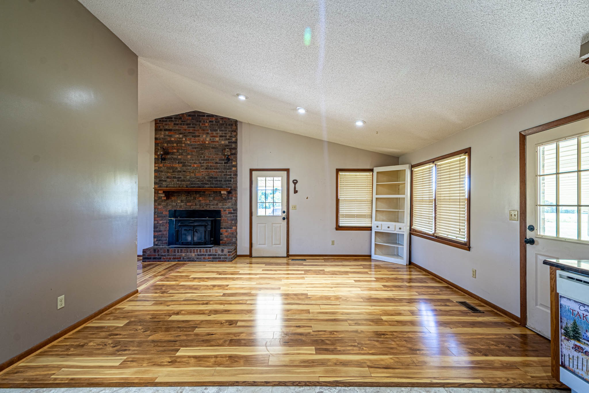 2515 Briar Patch Road Prospect, TN 38477 - Photo 18 of 43 a view of an empty room with a fireplace and a window