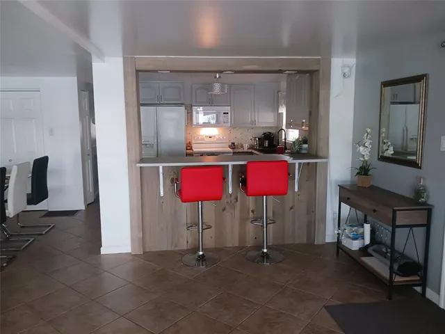 a living room with furniture a window and a table