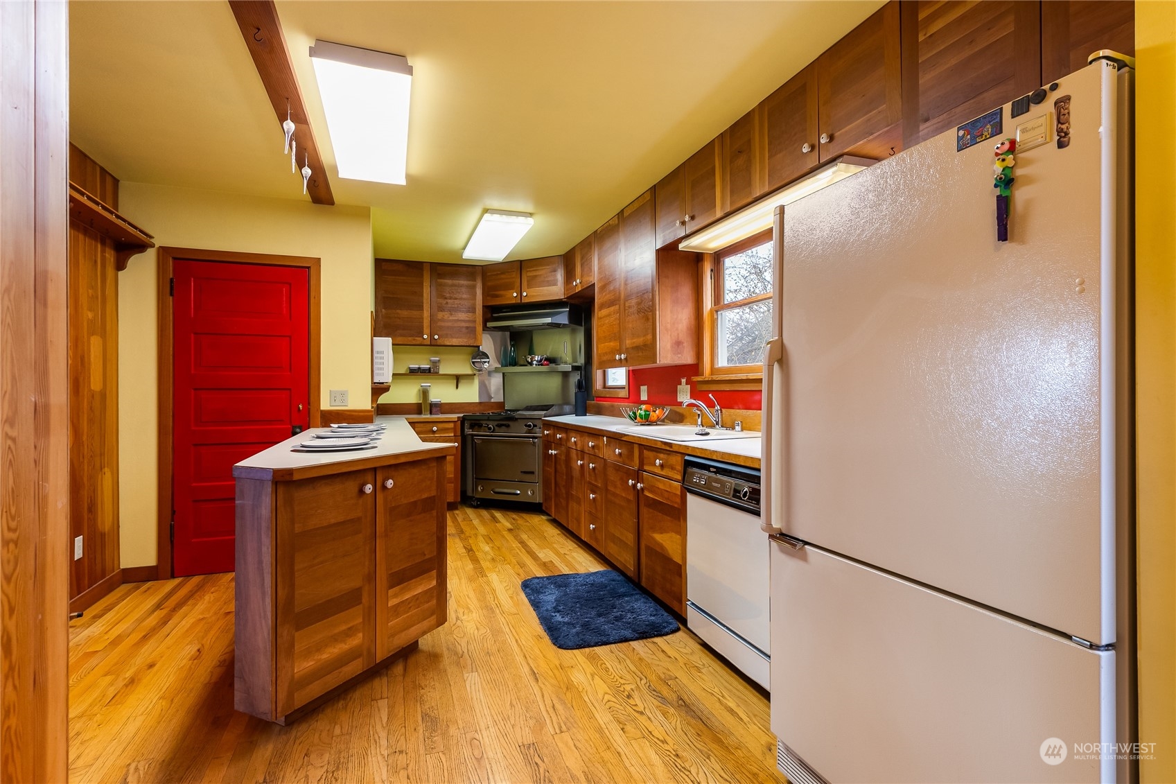 1015 14th Street Bellingham, WA 98225 - Photo 26 of 40 a kitchen with stainless steel appliances granite countertop a refrigerator a sink and a stove