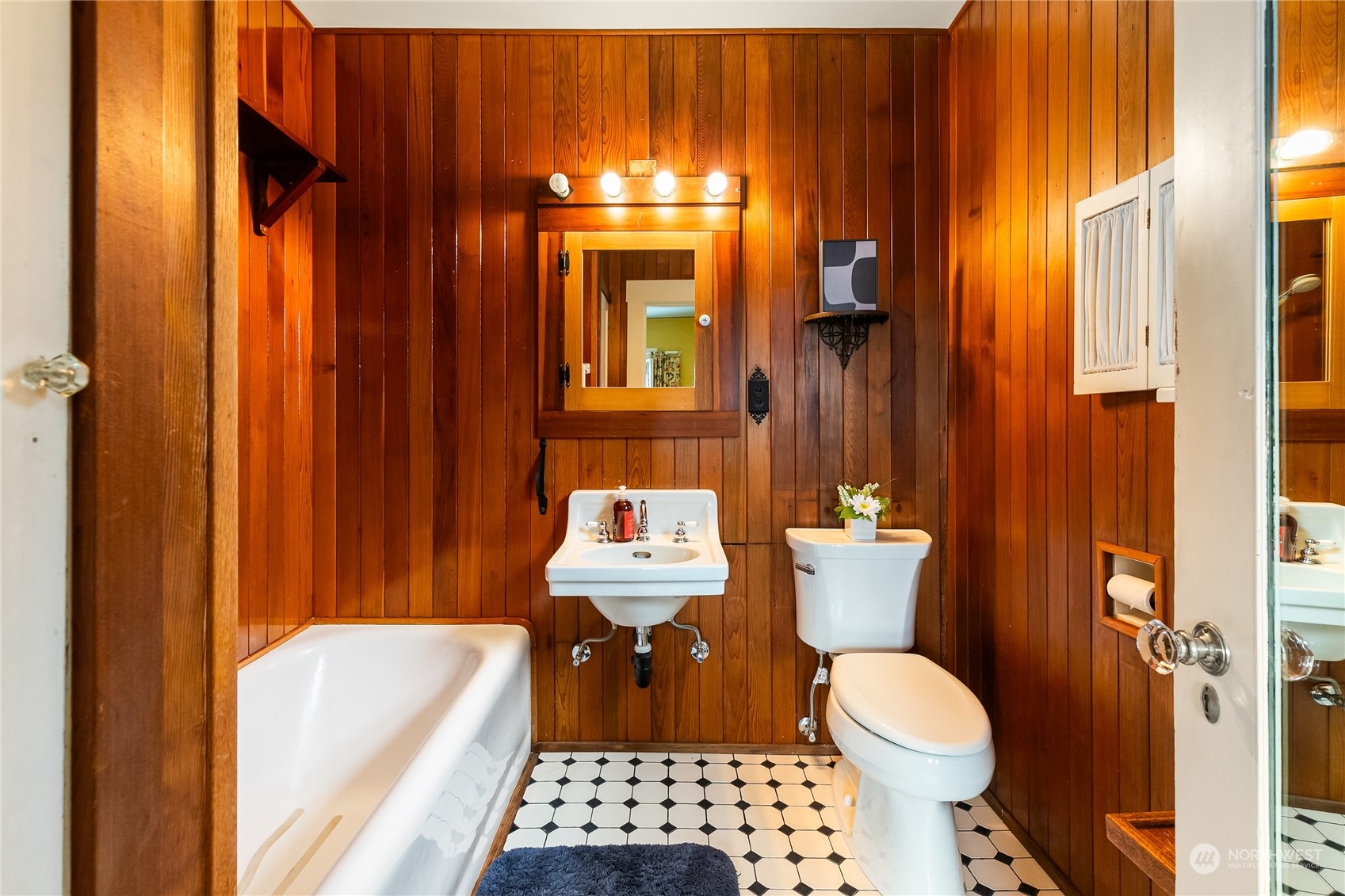 1015 14th Street Bellingham, WA 98225 - Photo 30 of 40 a bathroom with a toilet a sink and a shower curtain