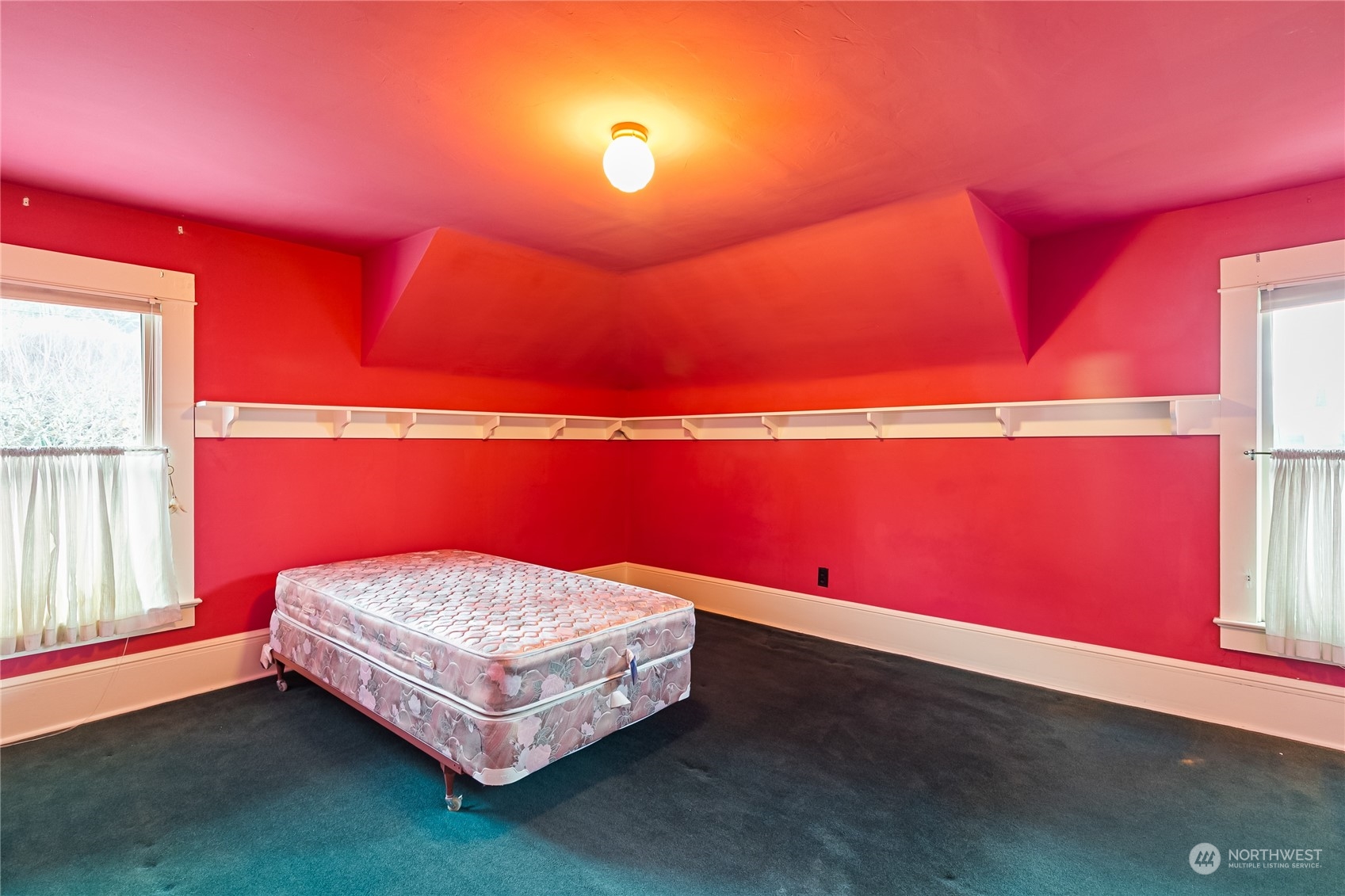 1015 14th Street Bellingham, WA 98225 - Photo 35 of 40 a bedroom with a bed and a window