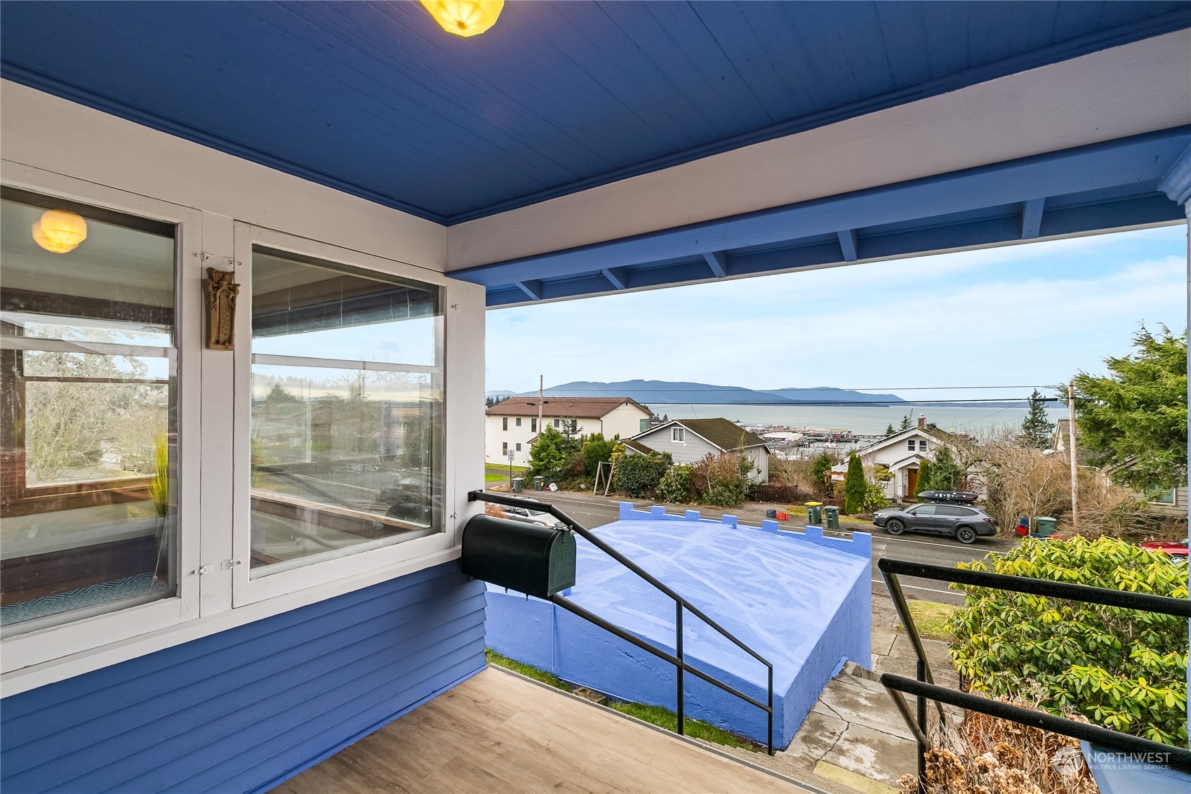 1015 14th Street Bellingham, WA 98225 - Photo 6 of 40 a view of a balcony with floor to ceiling windows with wooden floor