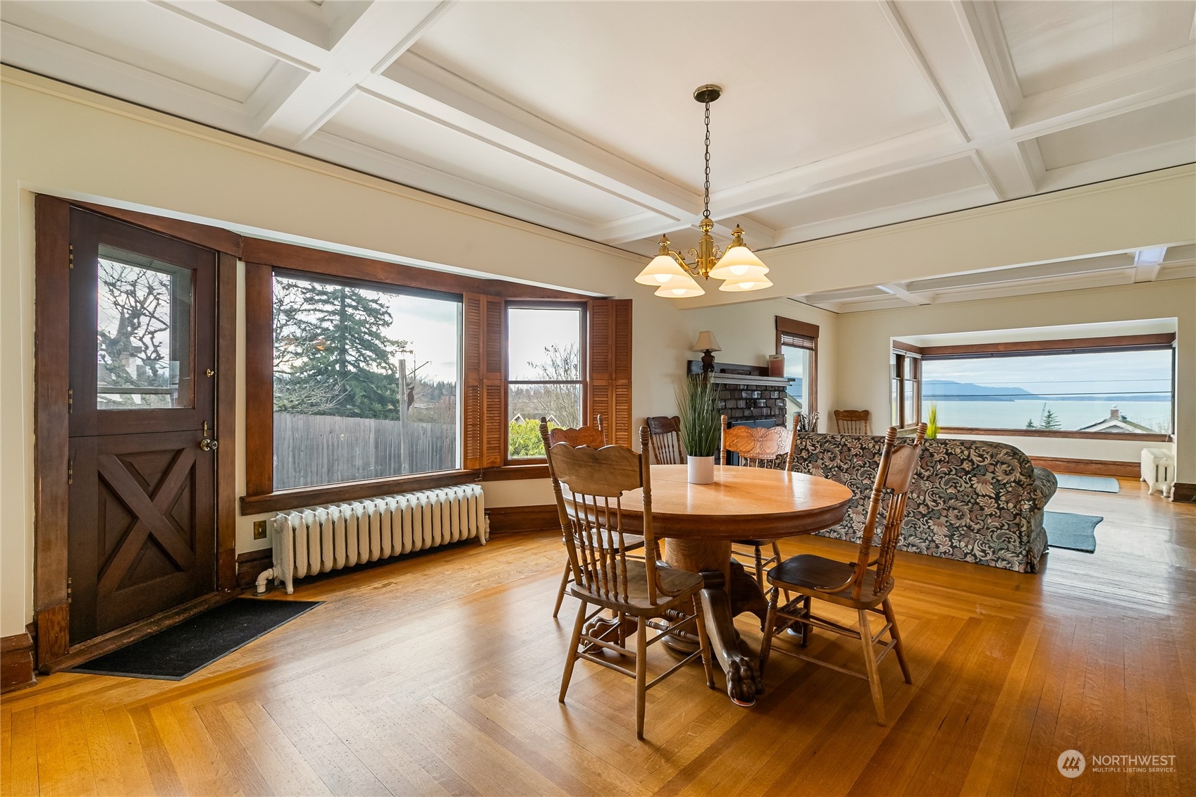 1015 14th Street Bellingham, WA 98225 - Photo 7 of 40 a dining room with furniture a chandelier and wooden floor