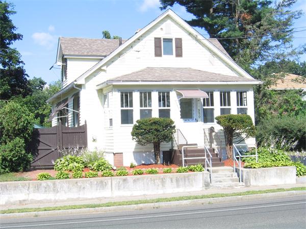 350 Granby Road Chicopee, MA 01013 - Photo 1 of 28 a front view of a house with a yard and potted plants
