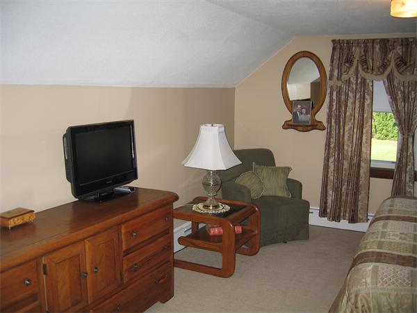 350 Granby Road Chicopee, MA 01013 - Photo 13 of 28 a living room with furniture and a flat screen tv