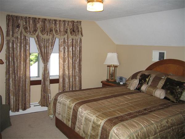 350 Granby Road Chicopee, MA 01013 - Photo 14 of 28 a bedroom with a bed and a window