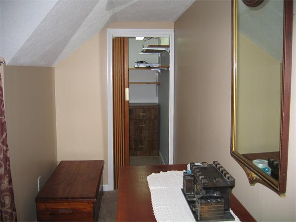 350 Granby Road Chicopee, MA 01013 - Photo 17 of 28 a room with a chair and wooden floor
