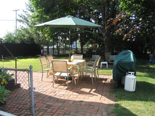 350 Granby Road Chicopee, MA 01013 - Photo 2 of 28 a view of a patio with a table chairs and a fire pit