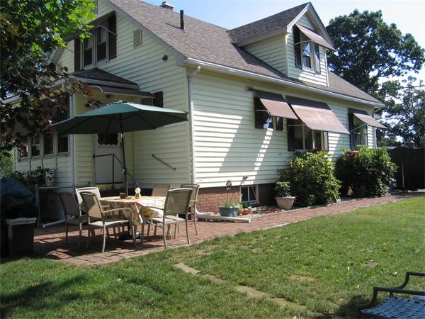 350 Granby Road Chicopee, MA 01013 - Photo 4 of 28 a view of a house with a yard and sitting area