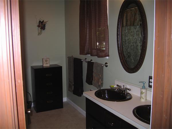350 Granby Road Chicopee, MA 01013 - Photo 5 of 28 a bathroom with a sink and a mirror