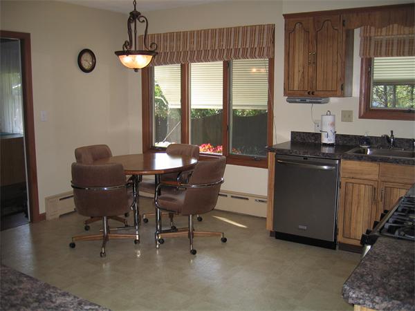 350 Granby Road Chicopee, MA 01013 - Photo 7 of 28 a kitchen with a table chairs and a window