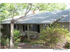 1695 Hogback Mountain Road Tryon, NC 28782 - Photo 1 of 12 a view of house with a yard and potted plants