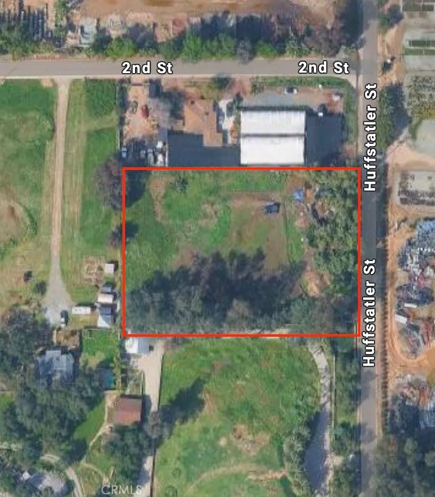 a view of a street with a building in the background