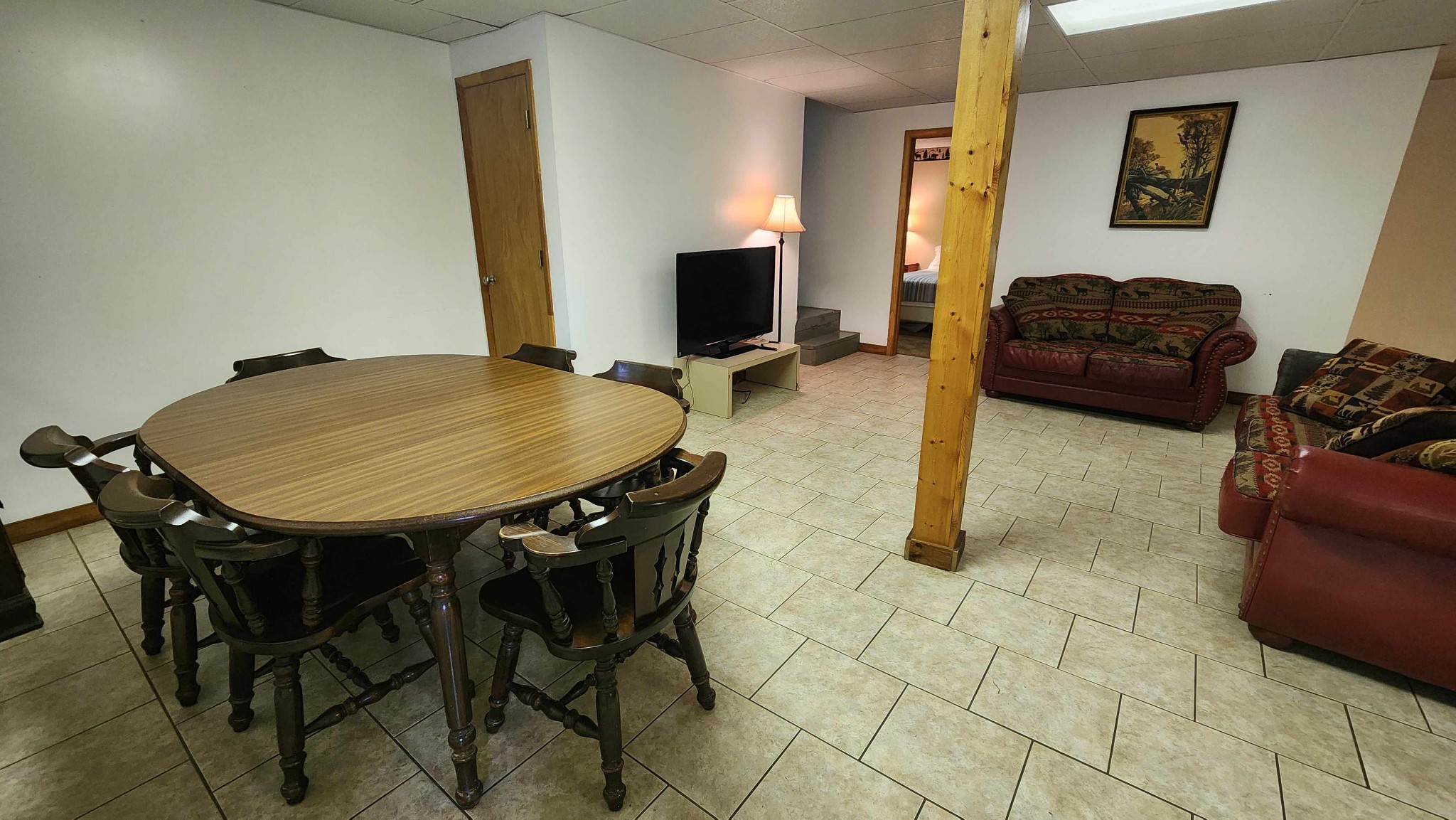 228 Bill Hunter Road Celina, TN 38551 - Photo 26 of 57 a living room with furniture a flat screen tv and a table